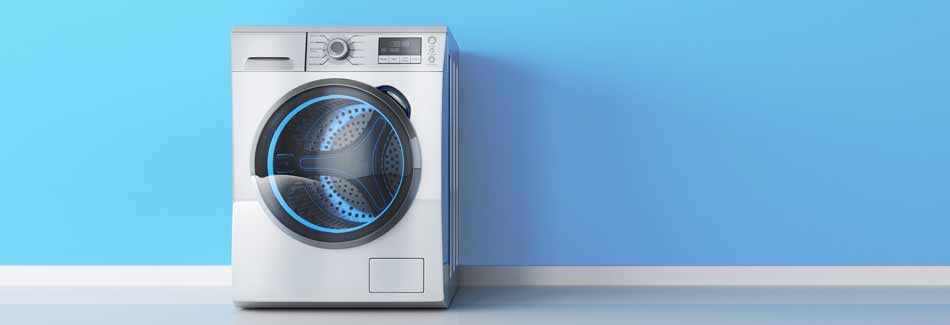 Waschmaschine kaufen: Eine Waschmaschine steht vor einer blauen Wand